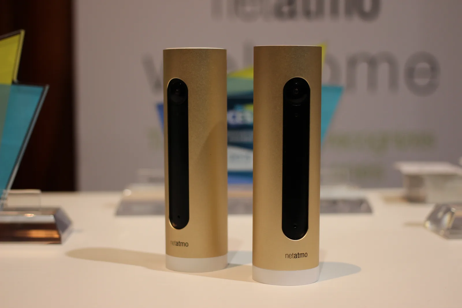 Two gold Netatmo Smart Indoor Cameras on display